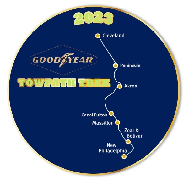 Blue pin with gold detailing that says 2023 Goodyear Towpath Trek with a line drawing of the Towpath Trail