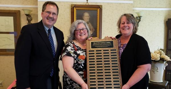 Dan, Karen, and Joyce holding plaque